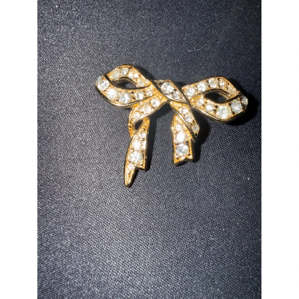 Monet Vintage Gold Tone Rhinestone Bow Brooch Pin Signed Classic Ribbon Jewelry